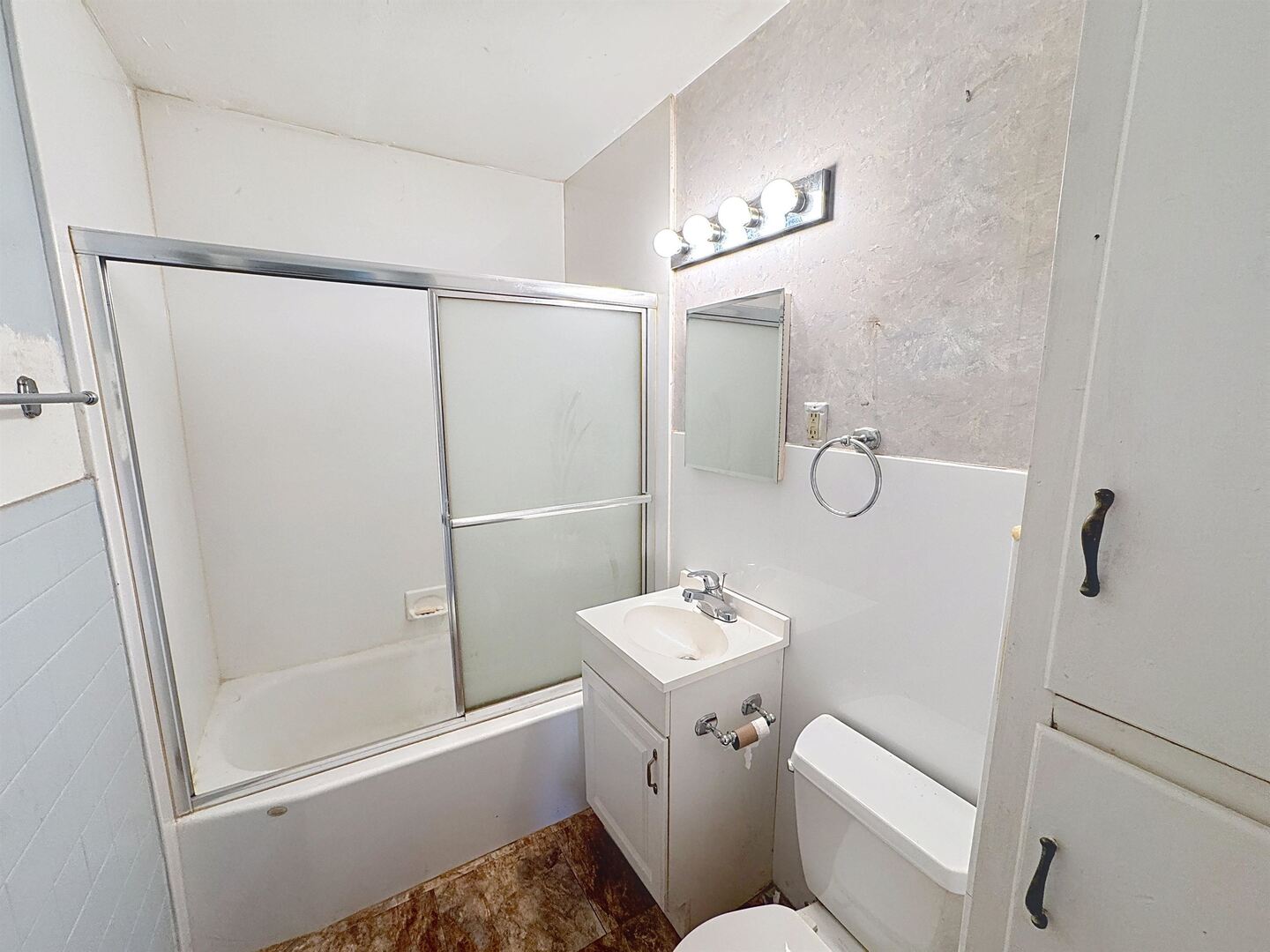 1213 29th Ave Court Moline, IL 61265 - Photo 10 of 17 a bathroom with a sink a toilet a mirror and shower