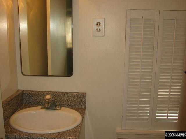 690 Georgia Place Reno, NV 89509 - Photo 7 of 9 a bathroom with a toilet and a sink