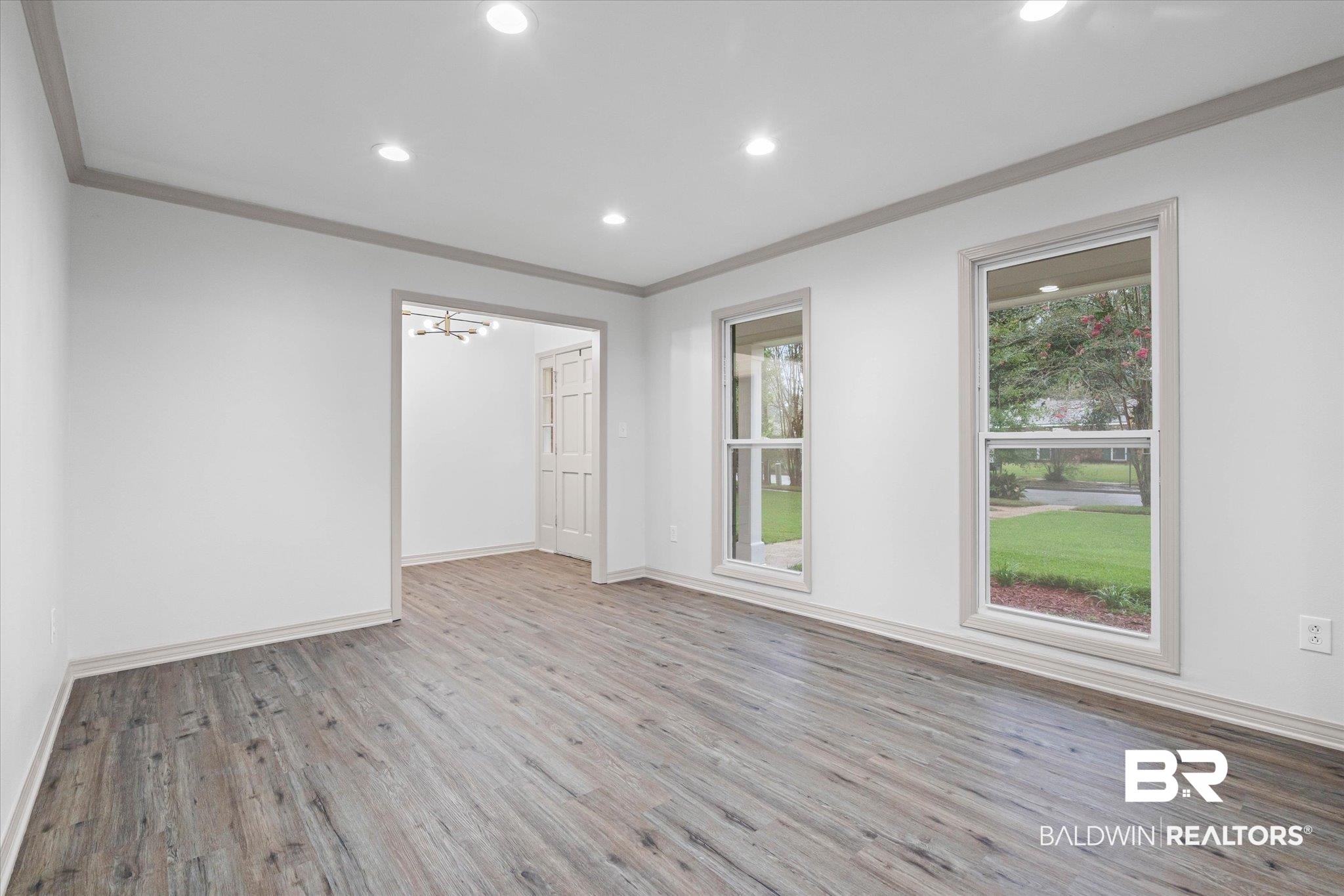 3655 Claridge Road South Mobile, AL 36608 - Photo 6 of 32 Spare room with crown molding, recessed lighting, light wood finished floors, and a chandelier