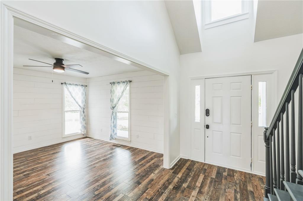 500 Coleman Mill Road Carrollton, GA 30116 - Photo 5 of 83 a view of empty room with wooden floor and fan