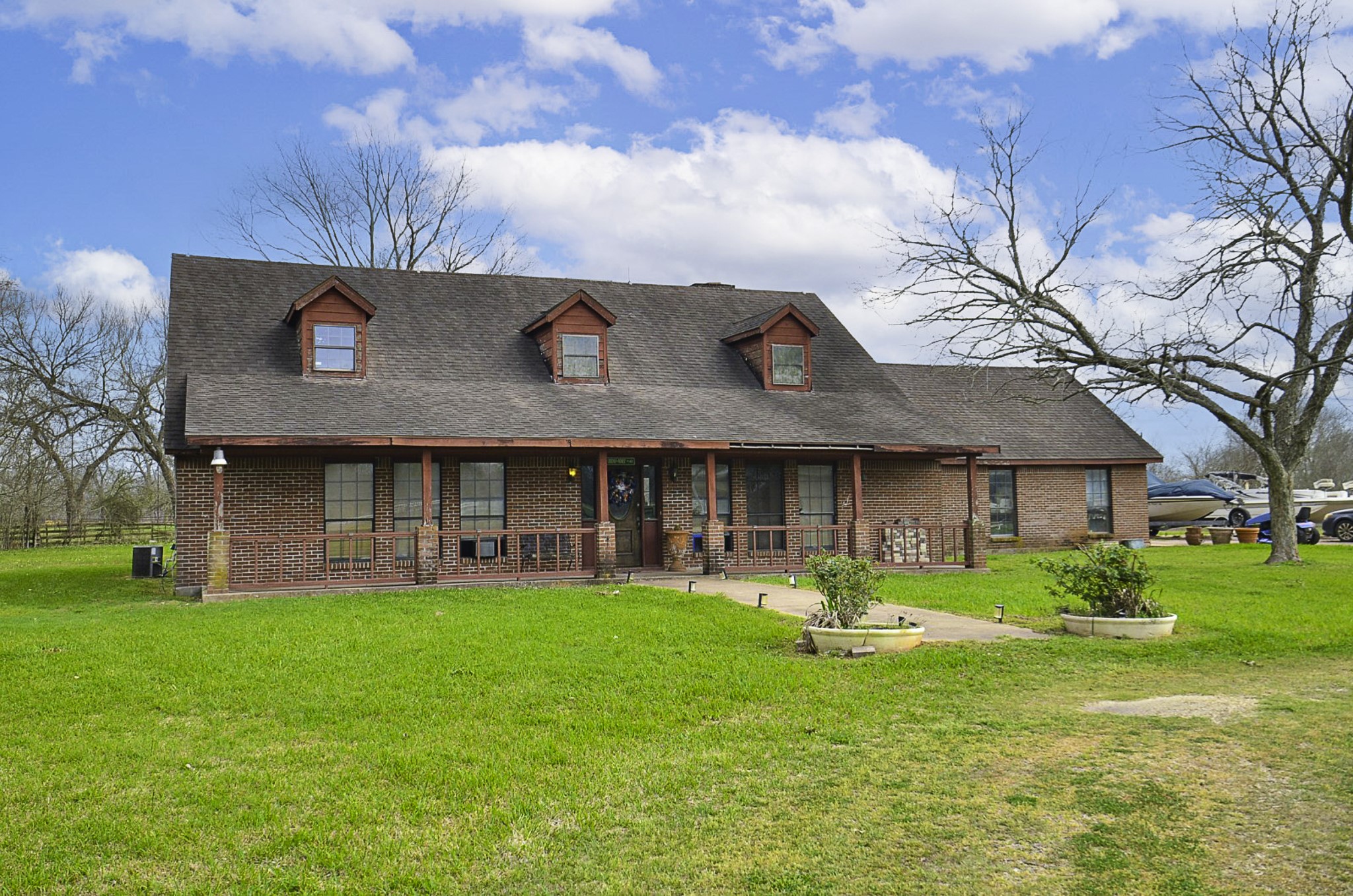 34520 Fulshear Farms Road Fulshear, TX 77441 - Photo 1 of 19 a view of a house with a yard porch and sitting area