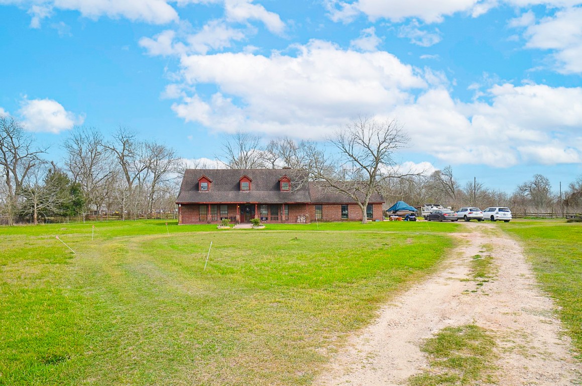34520 Fulshear Farms Road Fulshear, TX 77441 - Photo 12 of 19 a view of a house with a big yard