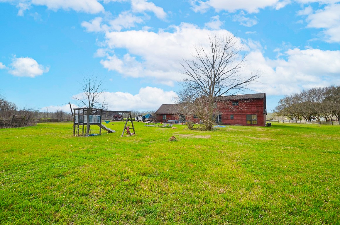 34520 Fulshear Farms Road Fulshear, TX 77441 - Photo 17 of 19 a table and chairs in the middle of a field