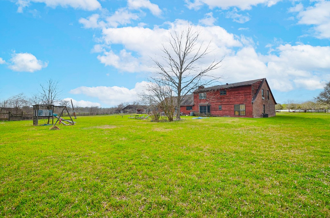 34520 Fulshear Farms Road Fulshear, TX 77441 - Photo 19 of 19 a view of a house with a big yard