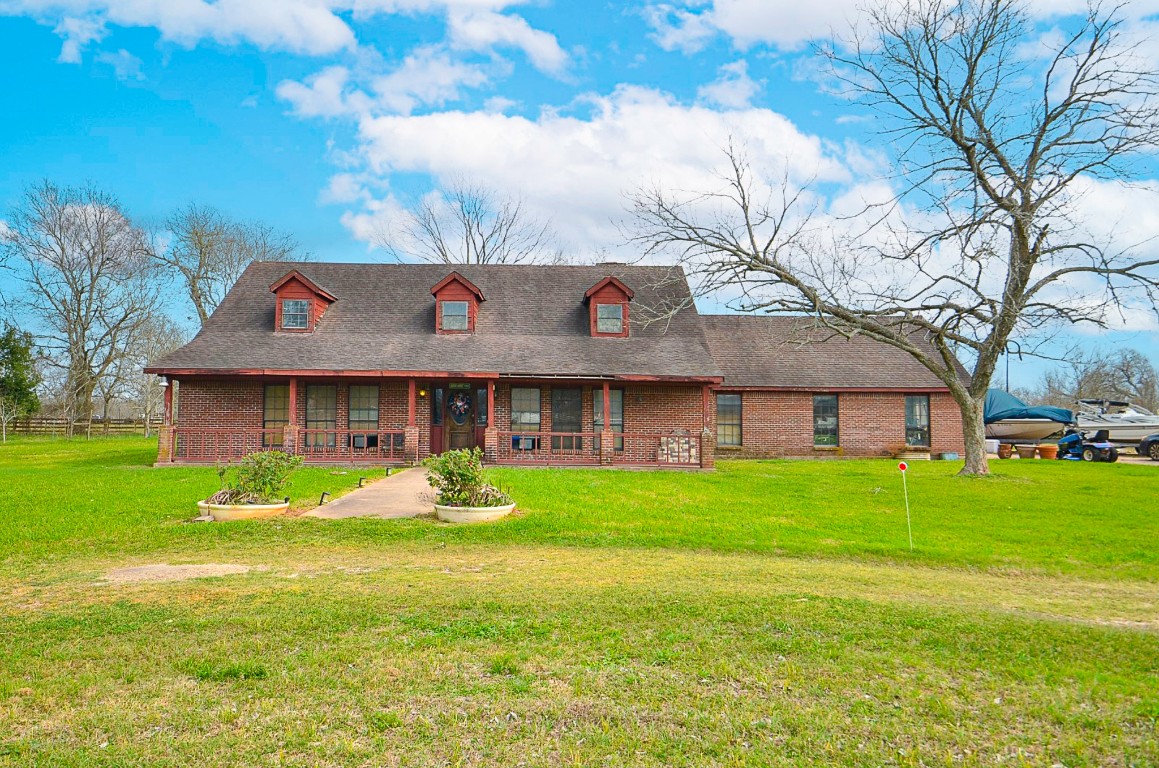 34520 Fulshear Farms Road Fulshear, TX 77441 - Photo 2 of 19 a front view of house with yard and trees