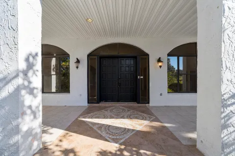 a view of a windows and chandelier in a room