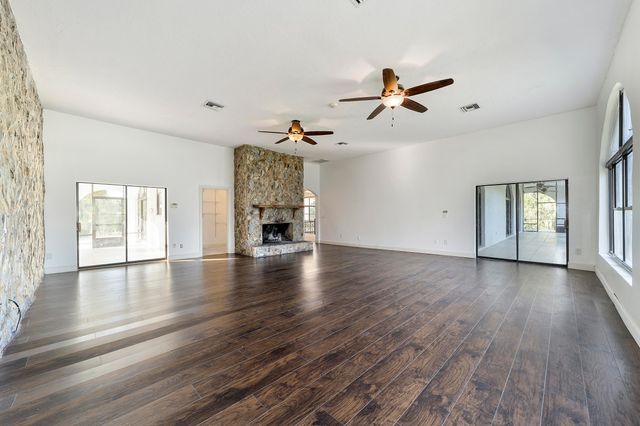 a view of a house with backyard and deck