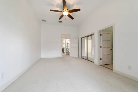 a view of a porch with furniture and garden