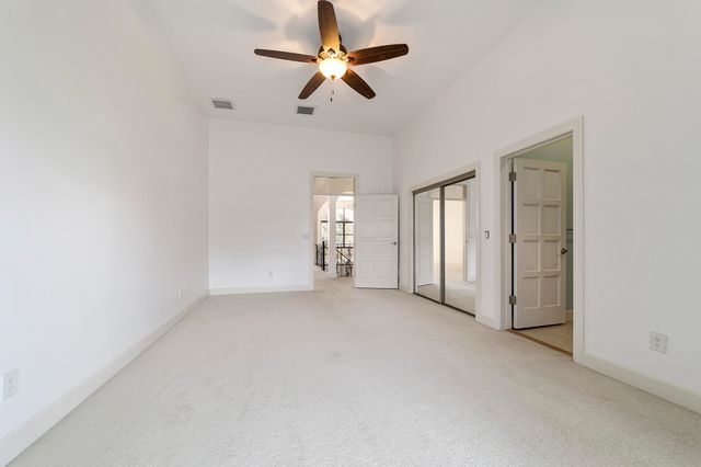 a view of a porch with furniture and garden