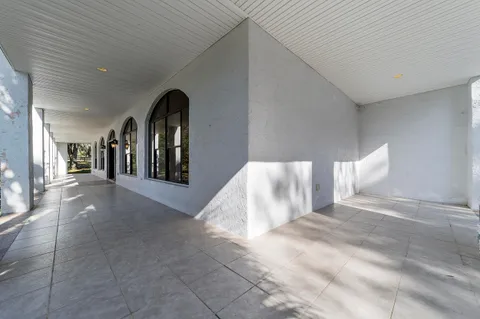 a view of a livingroom with furniture and staircase