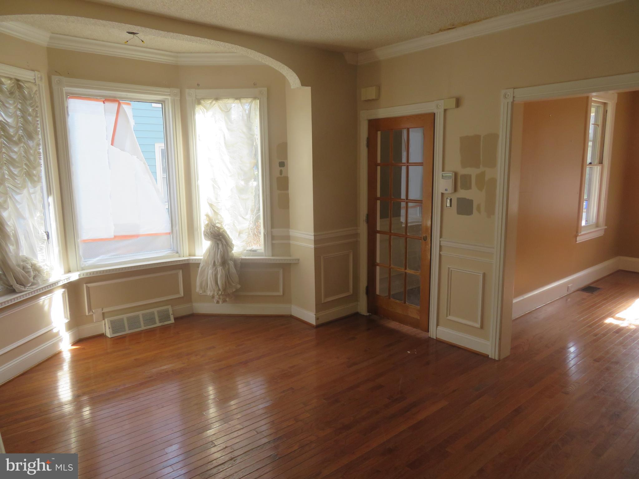 125 West Cottage Avenue Haddonfield, NJ 08033 - Photo 11 of 38 an empty room with wooden floor and windows
