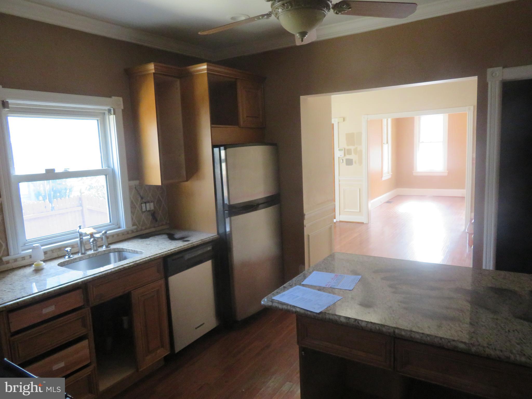 125 West Cottage Avenue Haddonfield, NJ 08033 - Photo 14 of 38 a kitchen with stainless steel appliances granite countertop a sink refrigerator and window