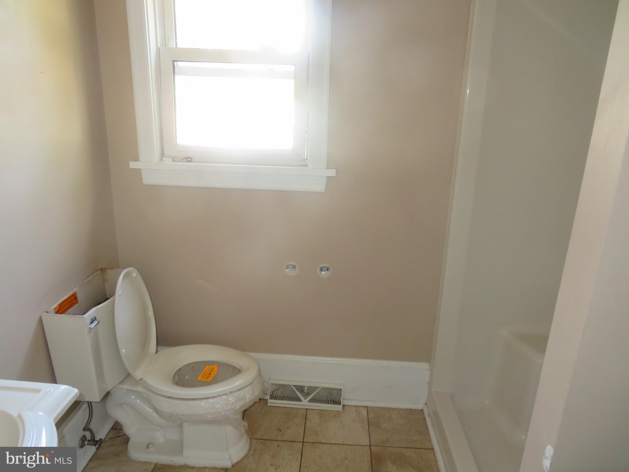 125 West Cottage Avenue Haddonfield, NJ 08033 - Photo 20 of 38 a white toilet sitting next to a window