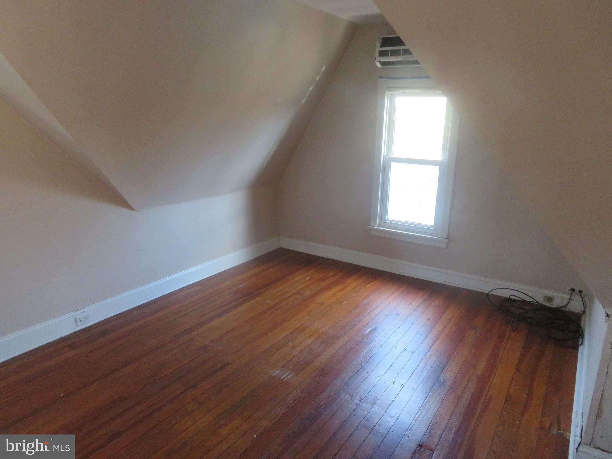 125 West Cottage Avenue Haddonfield, NJ 08033 - Photo 21 of 38 an empty room with wooden floor and windows