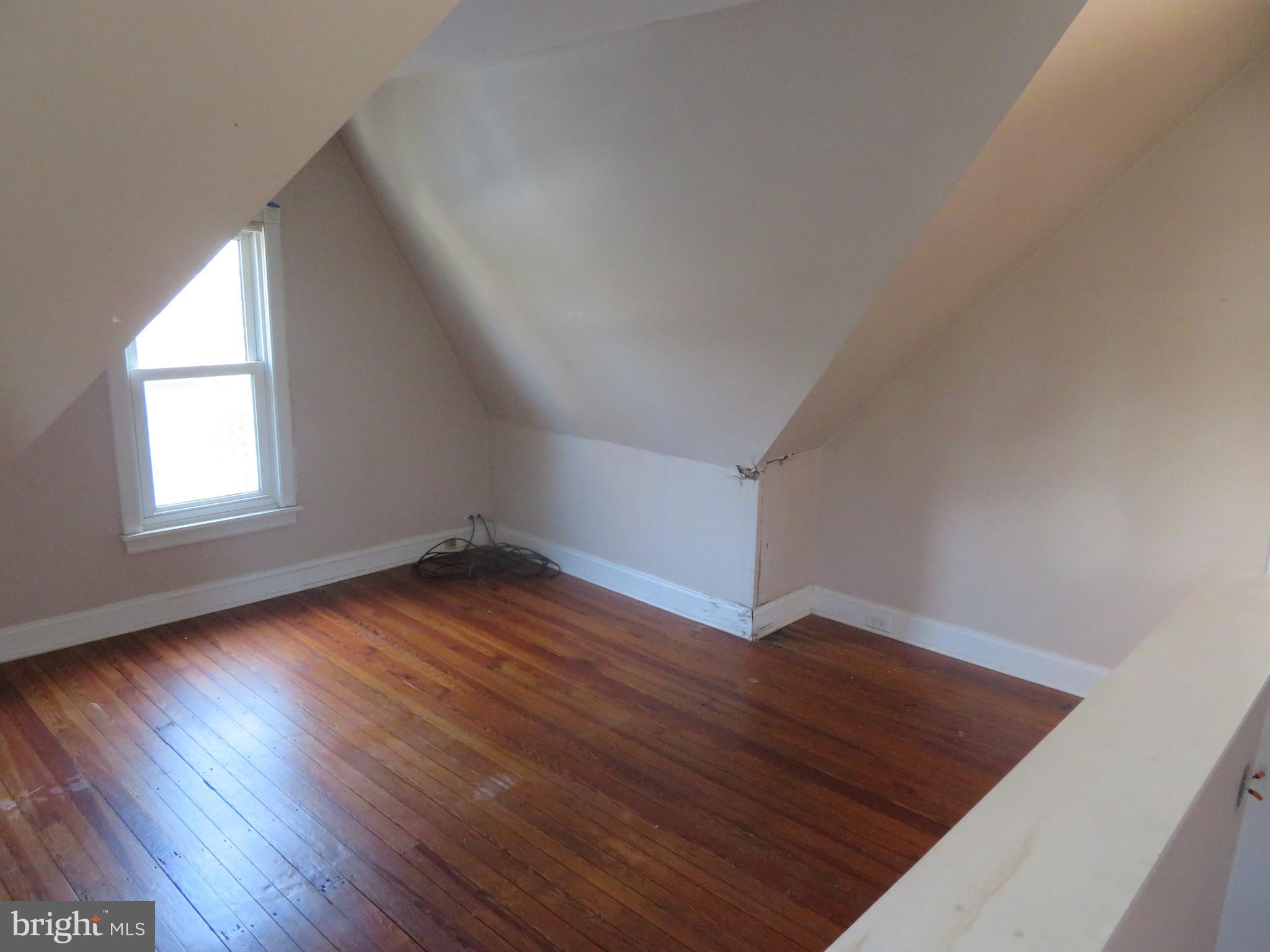 125 West Cottage Avenue Haddonfield, NJ 08033 - Photo 22 of 38 an empty room with wooden floor and windows
