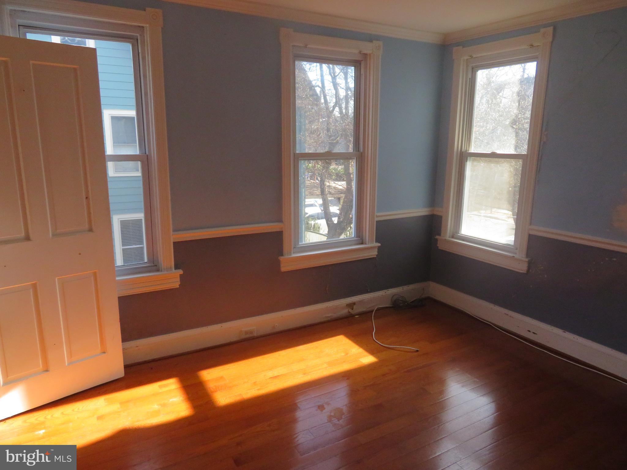 125 West Cottage Avenue Haddonfield, NJ 08033 - Photo 25 of 38 a view of an empty room with wooden floor and a window