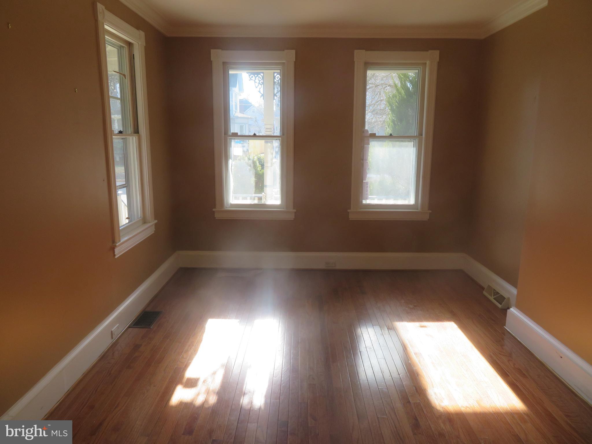 125 West Cottage Avenue Haddonfield, NJ 08033 - Photo 7 of 38 a view of empty room with wooden floor and fan