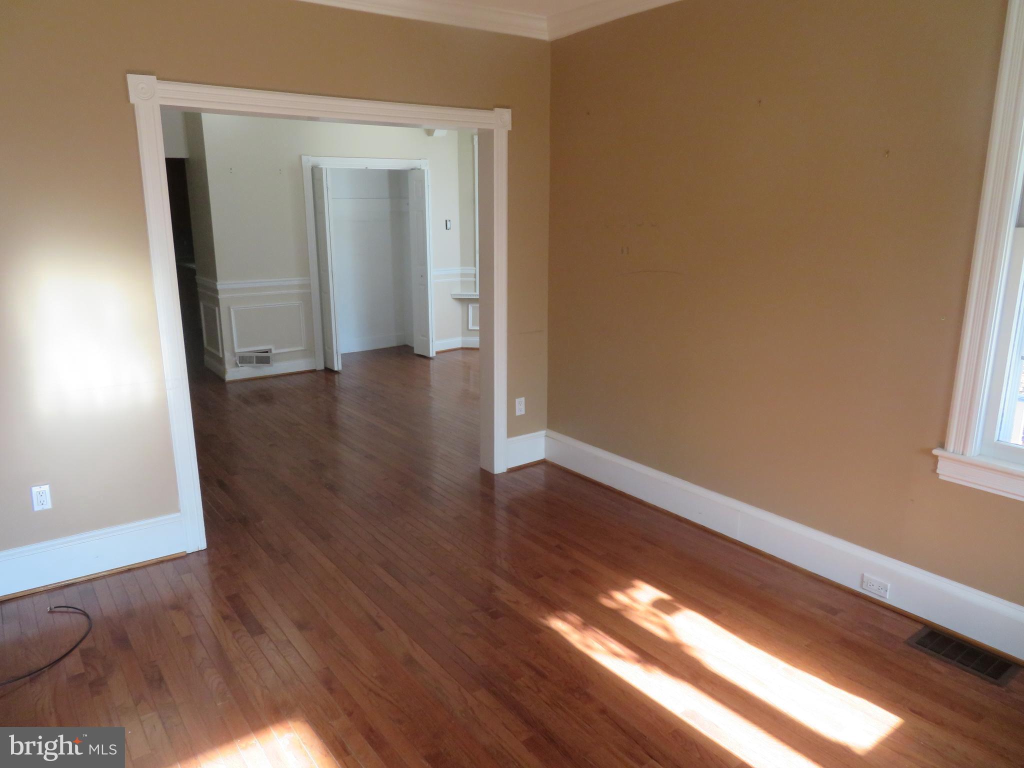 125 West Cottage Avenue Haddonfield, NJ 08033 - Photo 8 of 38 a view of an empty room with wooden floor and a window