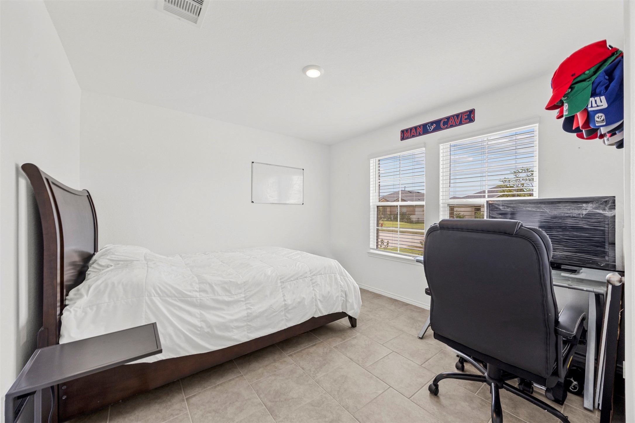 7511 Carson Court Rosharon, TX 77583 - Photo 13 of 26 Versatile bedroom space, ideal for guests, a home office, or whatever fits your lifestyle.