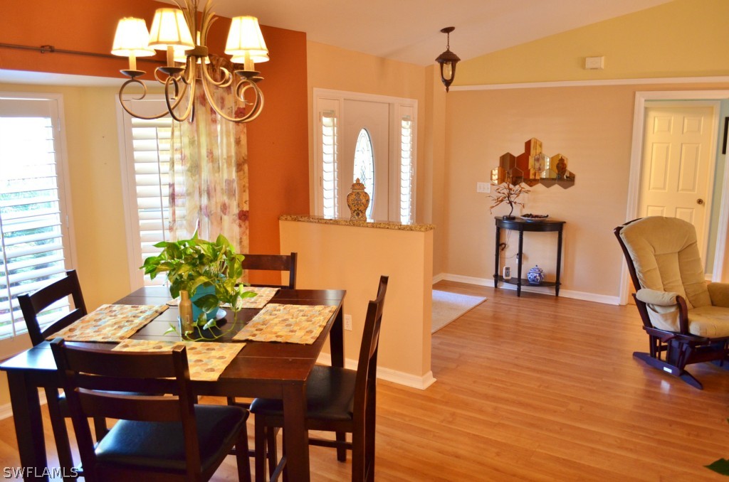 17432 Georgia Road Fort Myers, FL 33967 - Photo 4 of 20 a view of a dining room with furniture window and wooden floor