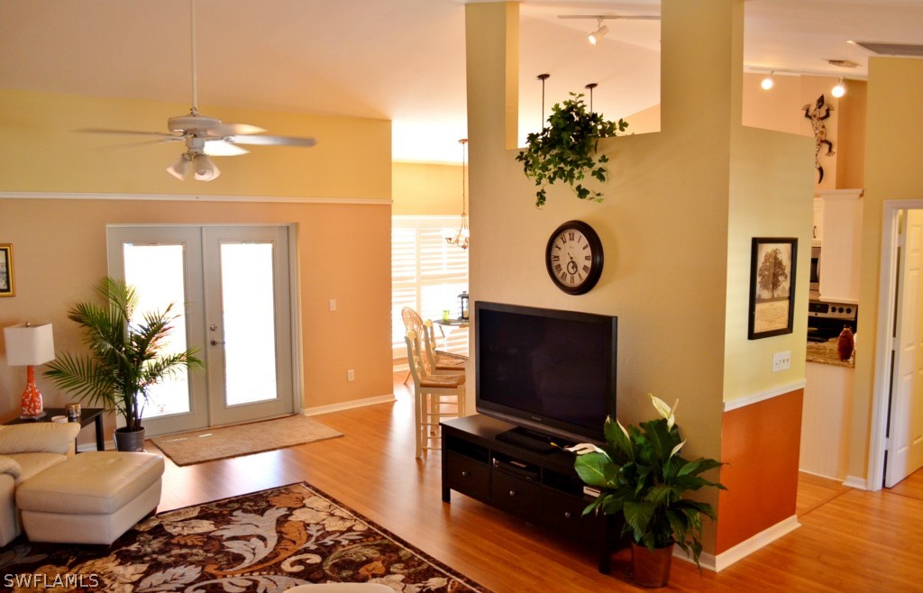 17432 Georgia Road Fort Myers, FL 33967 - Photo 6 of 20 a living room with fireplace furniture and a potted plant