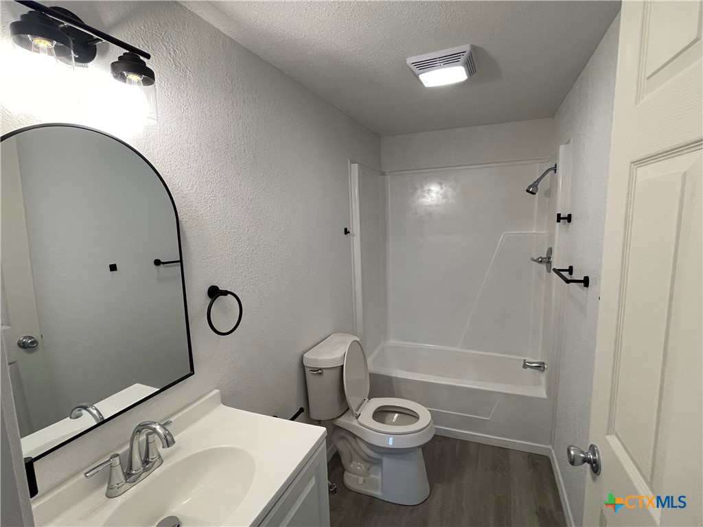 60 County Road 304 Goldthwaite, TX 76844 - Photo 12 of 23 a bathroom with a sink toilet and shower