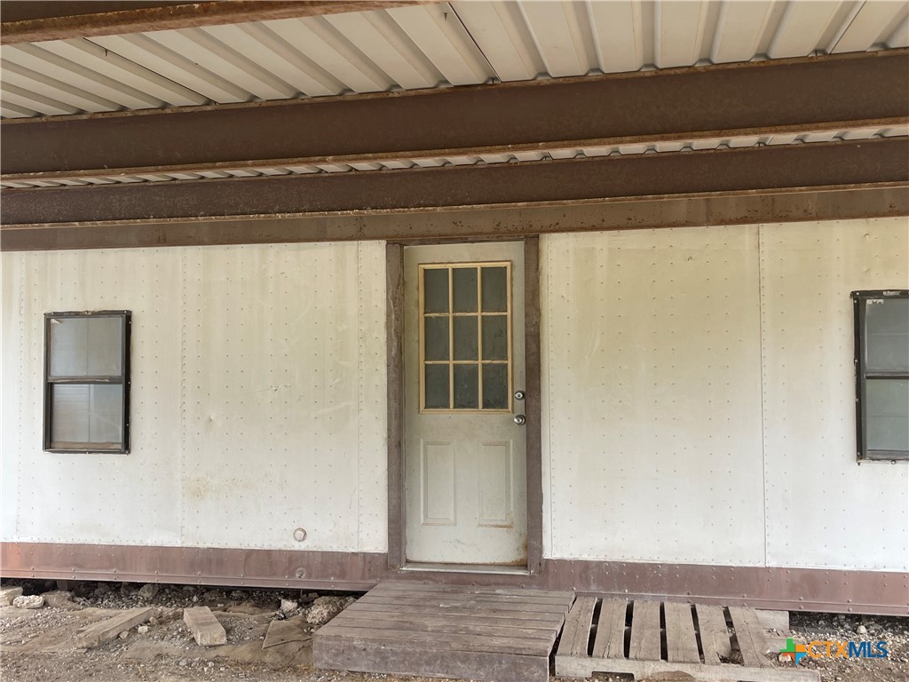 60 County Road 304 Goldthwaite, TX 76844 - Photo 19 of 23 a view of a livingroom with wooden floor and cabinet