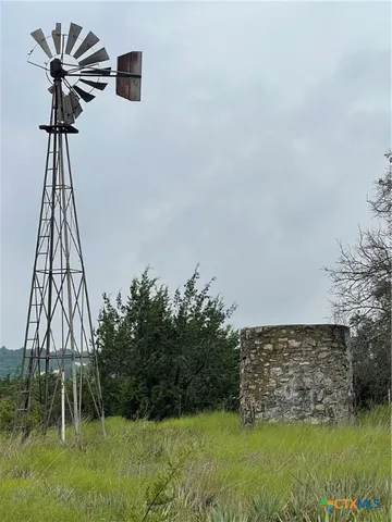 a view of a swimming pool with a yard