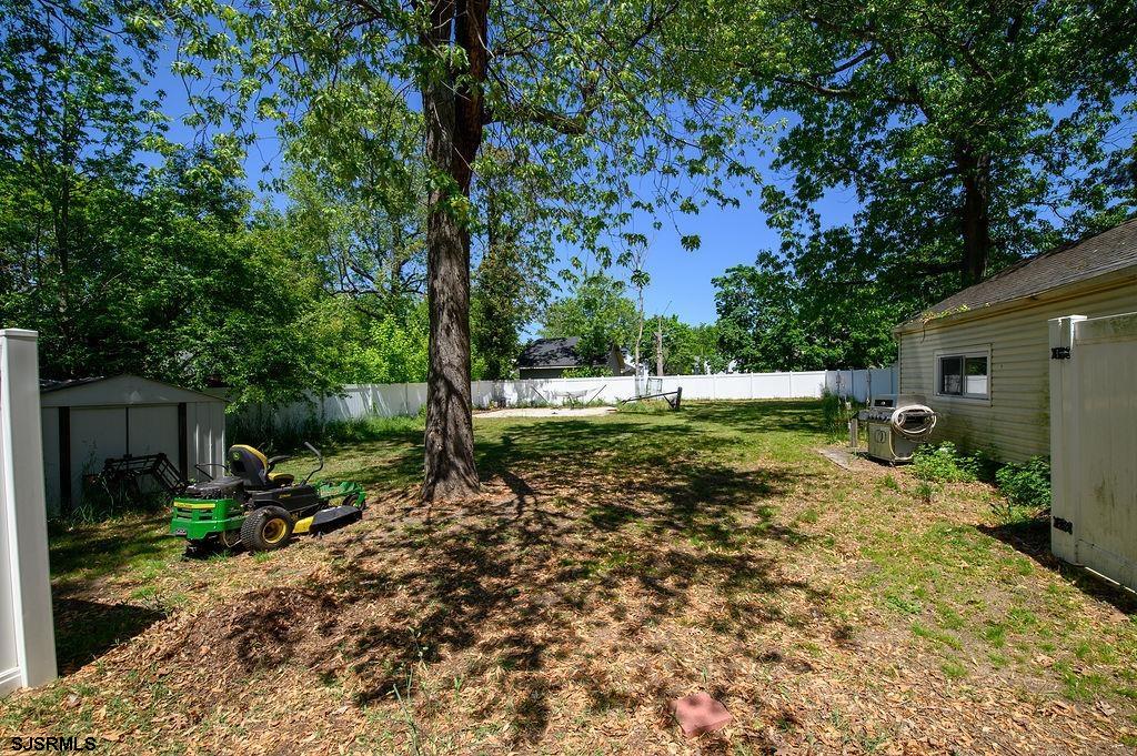 19 South 1st Road Hammonton, NJ 08037 - Photo 31 of 36 a backyard of a house with a garden and plants