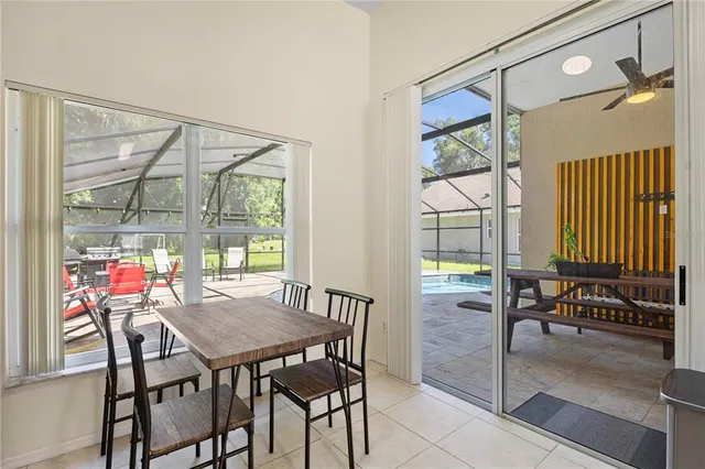 a view of a dining room with furniture window and outside view