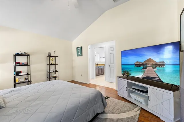 a bathroom with a granite countertop sink mirror and a bath tub