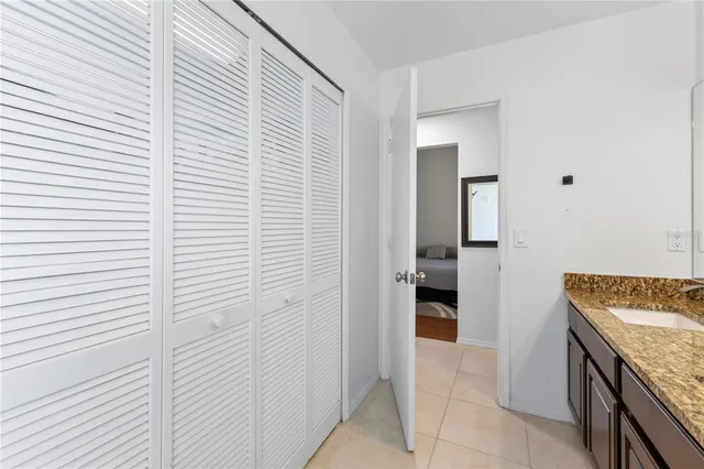 a white bath tub sitting next to a white toilet and a shower