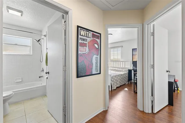 a bedroom with a bed and a desk