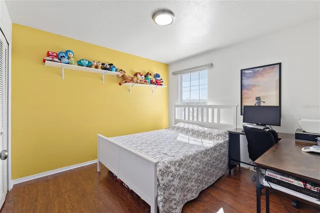 a bedroom with a bed and a table