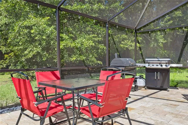 an aerial view of a house with outdoor space and parking