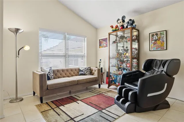 a living room with furniture rug and a large window
