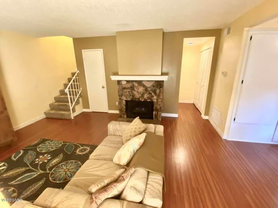 527 Spring Road, Unit 18 Moorpark, CA 93021 - Photo 3 of 6 a bedroom with a bed and a fireplace