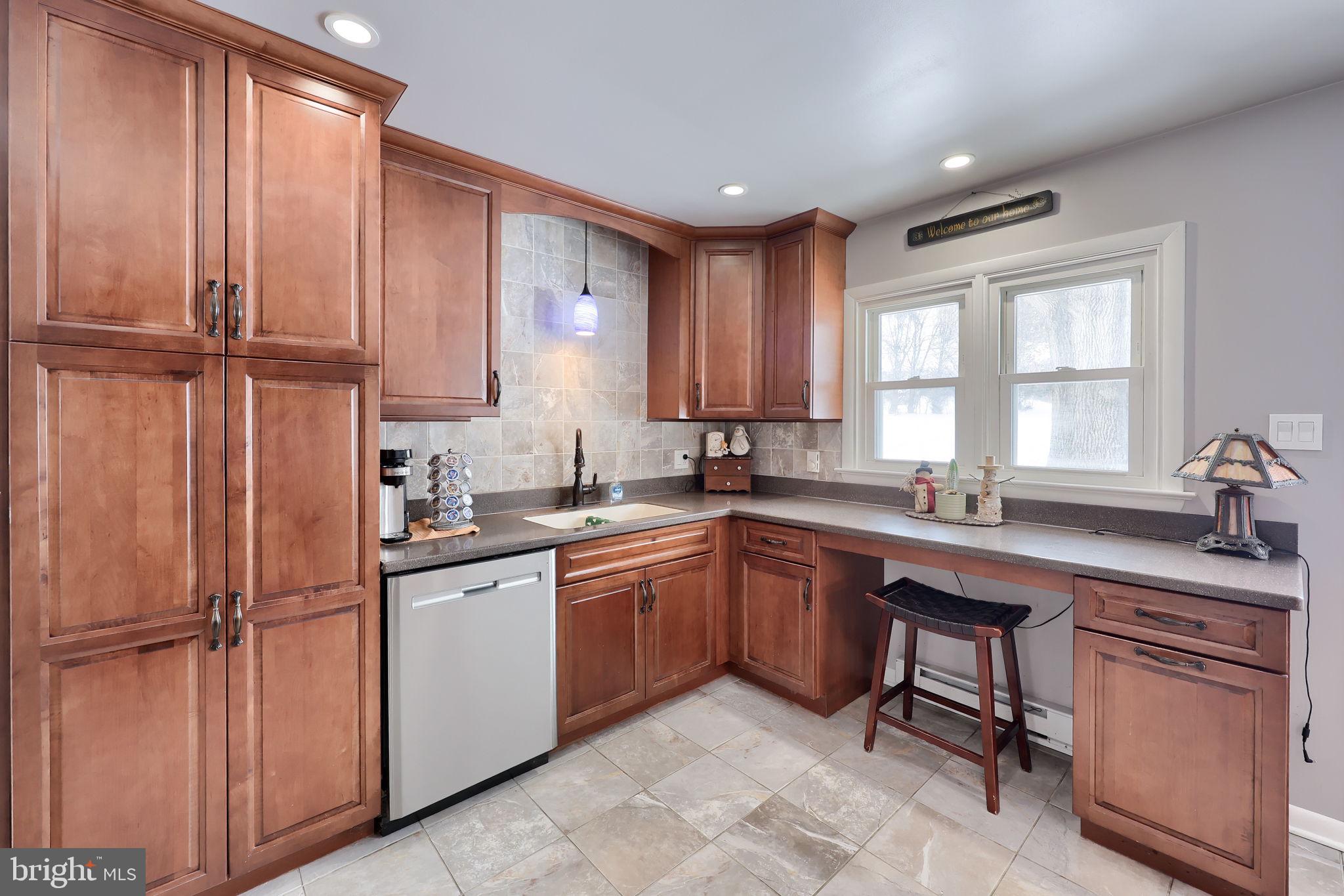 340 Primrose Avenue Lancaster, PA 17601 - Photo 16 of 47 a kitchen with stainless steel appliances granite countertop a sink window and cabinets