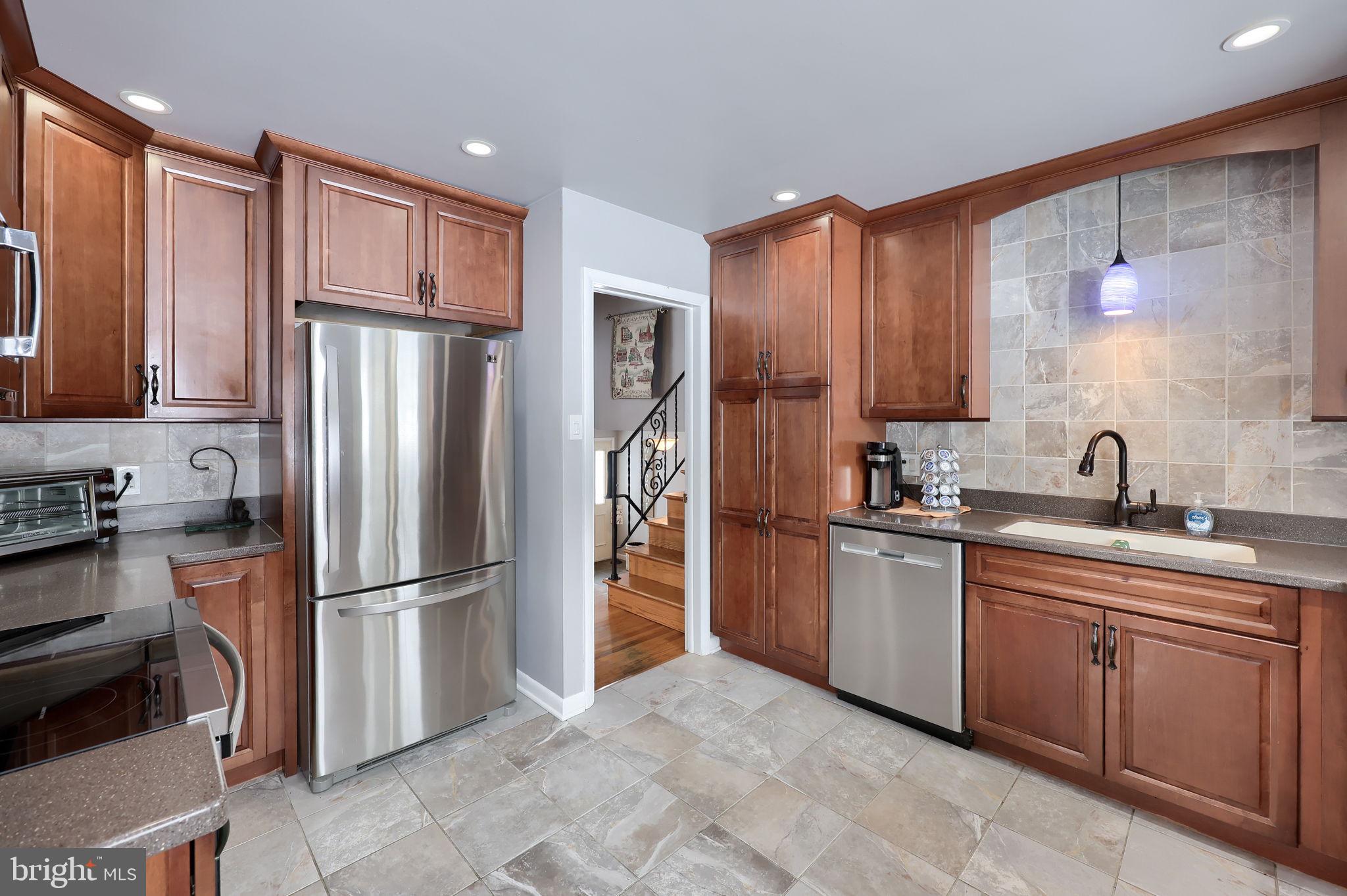 340 Primrose Avenue Lancaster, PA 17601 - Photo 17 of 47 a kitchen with stainless steel appliances granite countertop a refrigerator and a sink