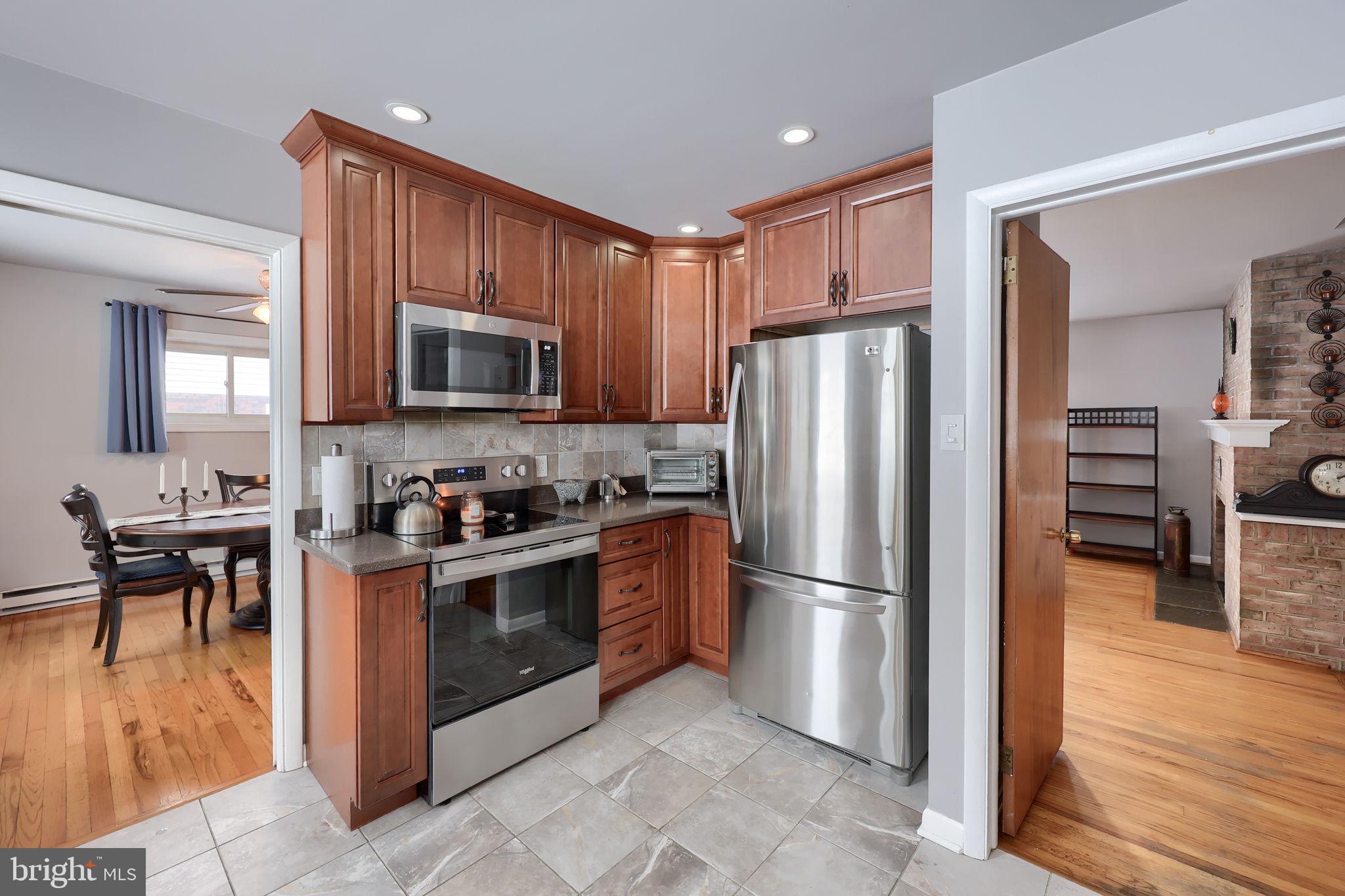 340 Primrose Avenue Lancaster, PA 17601 - Photo 18 of 47 a kitchen with stainless steel appliances granite countertop a refrigerator stove and microwave