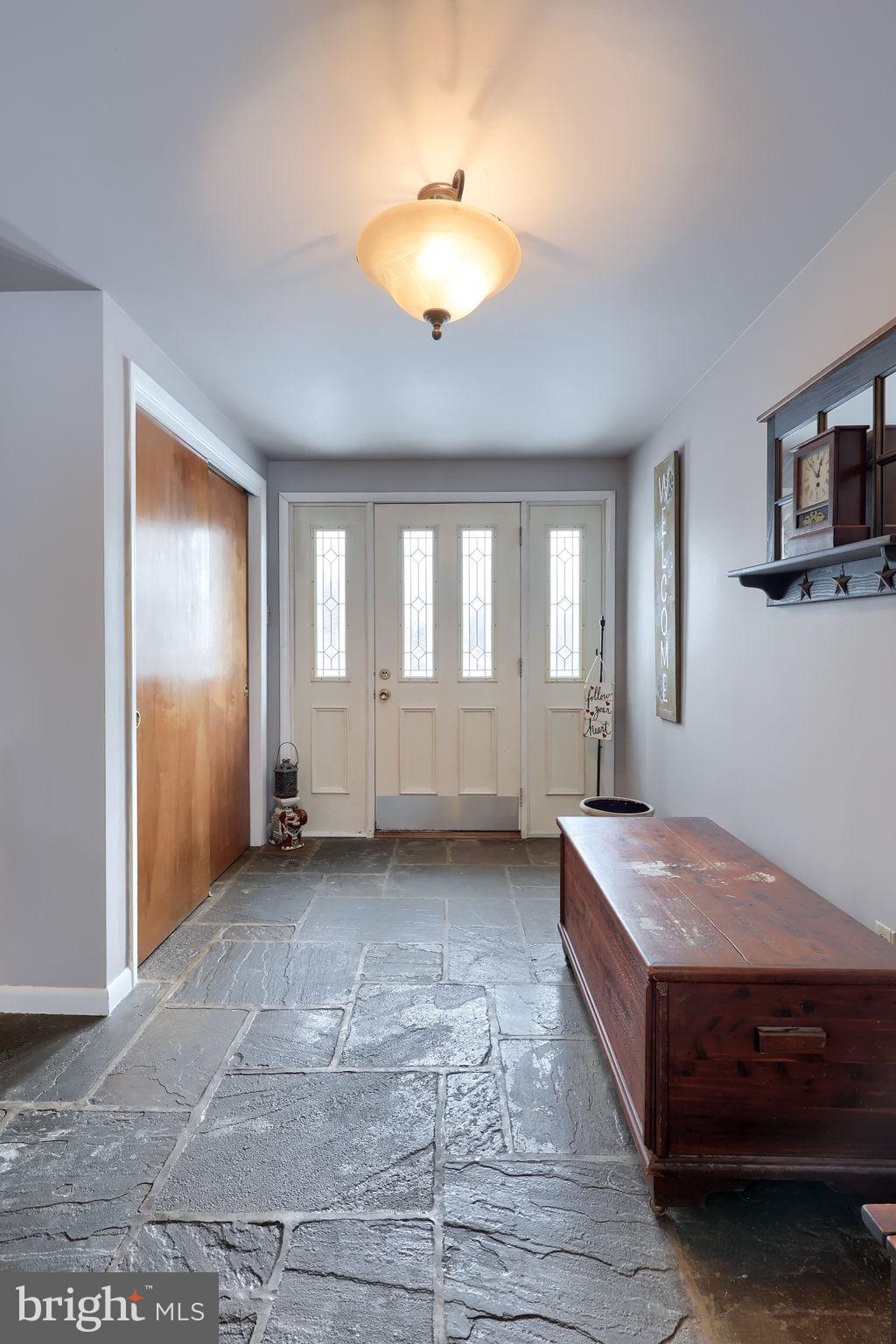 340 Primrose Avenue Lancaster, PA 17601 - Photo 2 of 47 a spacious bedroom with a bed and a chandelier
