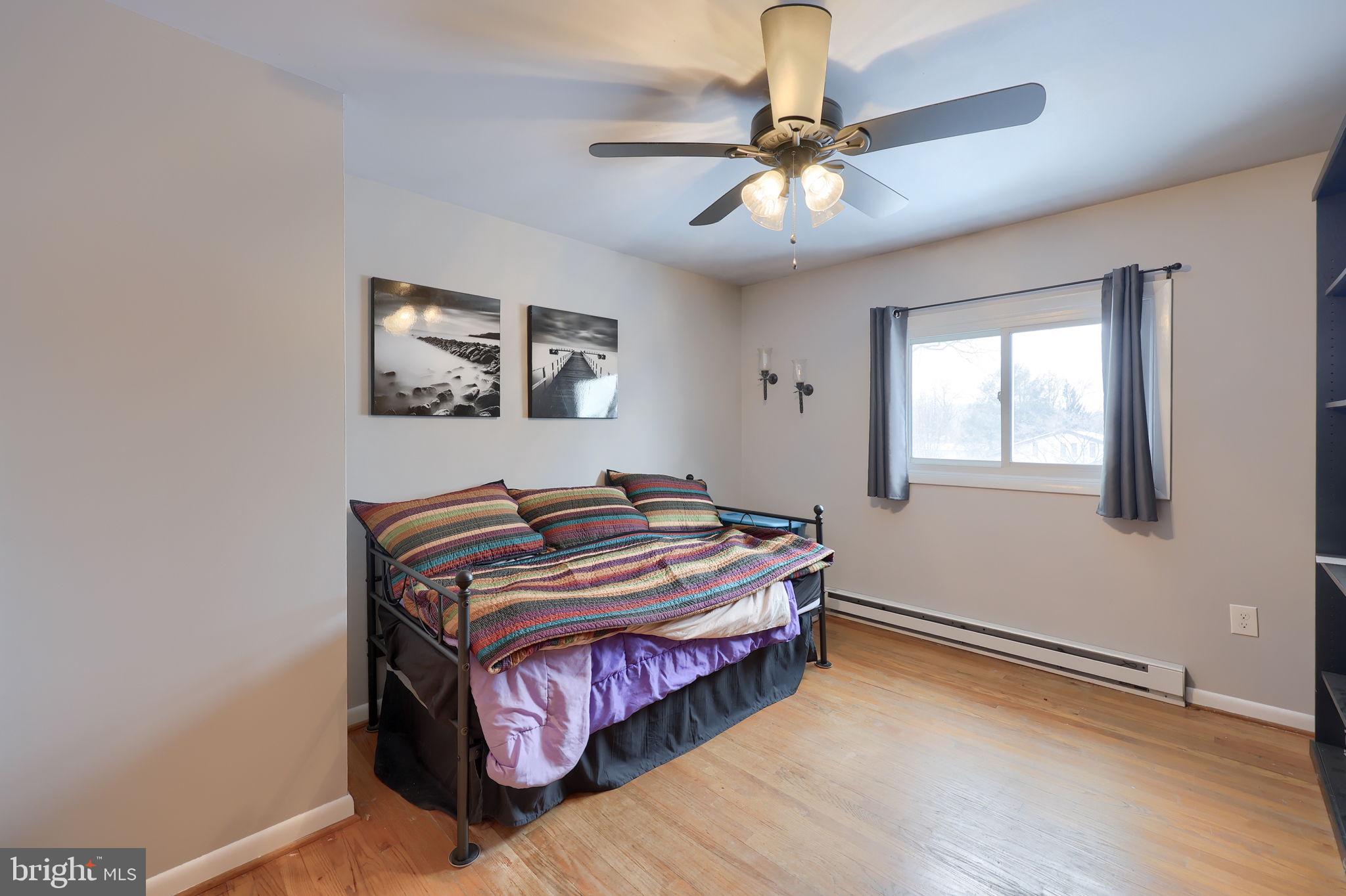 340 Primrose Avenue Lancaster, PA 17601 - Photo 28 of 47 a bedroom with a bed and a chandelier