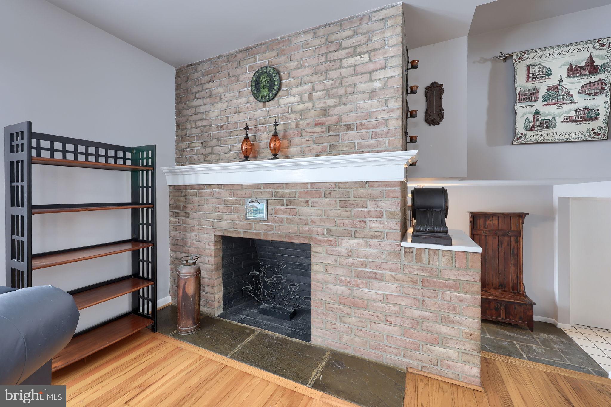 340 Primrose Avenue Lancaster, PA 17601 - Photo 5 of 47 a living room with a fireplace and a wooden floor