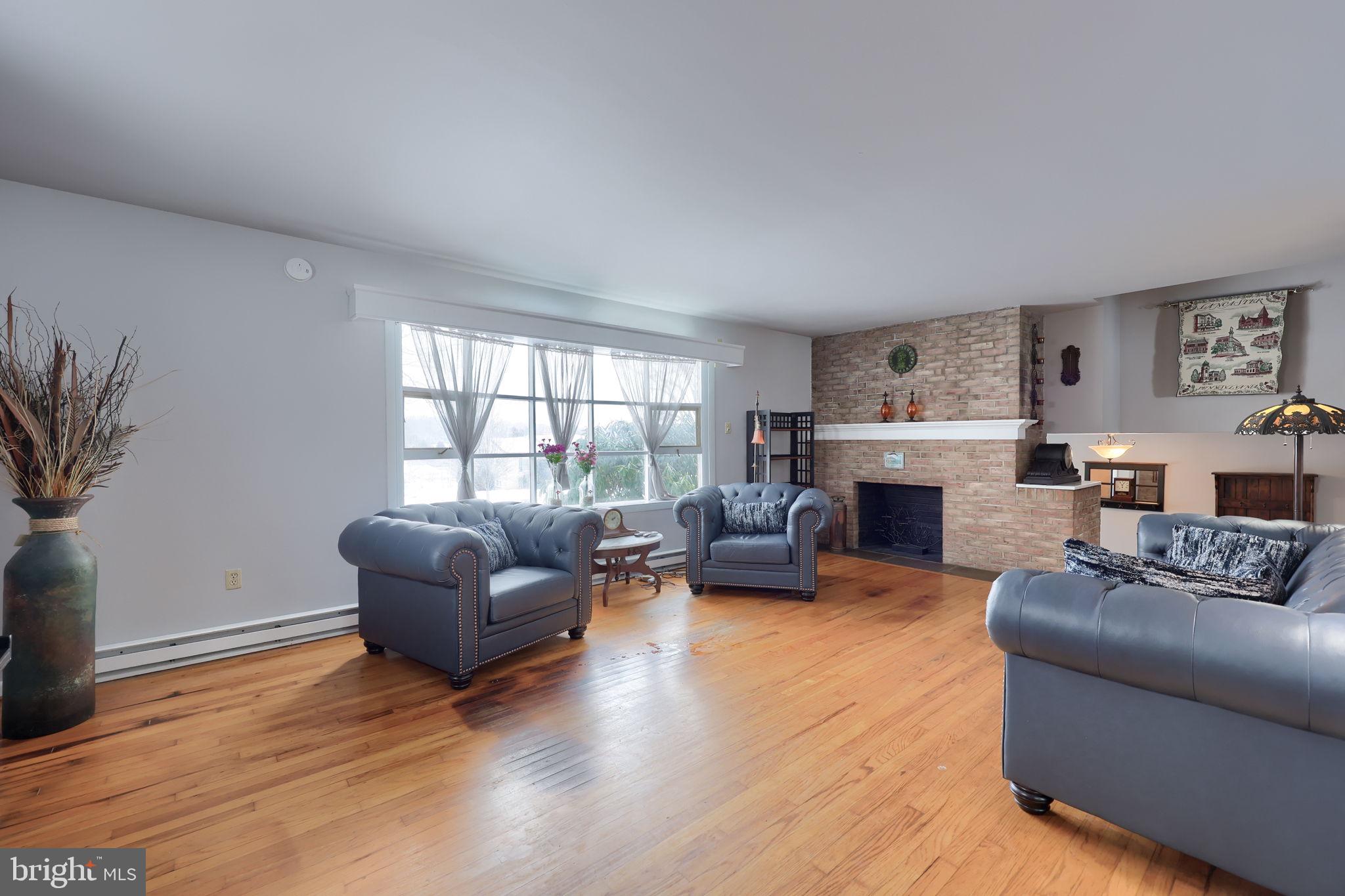 340 Primrose Avenue Lancaster, PA 17601 - Photo 6 of 47 a living room with furniture and a fireplace