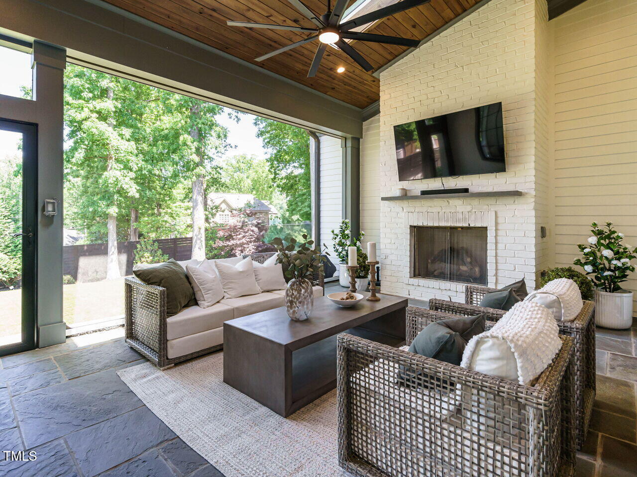 602 Shelley Road Raleigh, NC 27609 - Photo 20 of 64 a living room with furniture fireplace and a large window