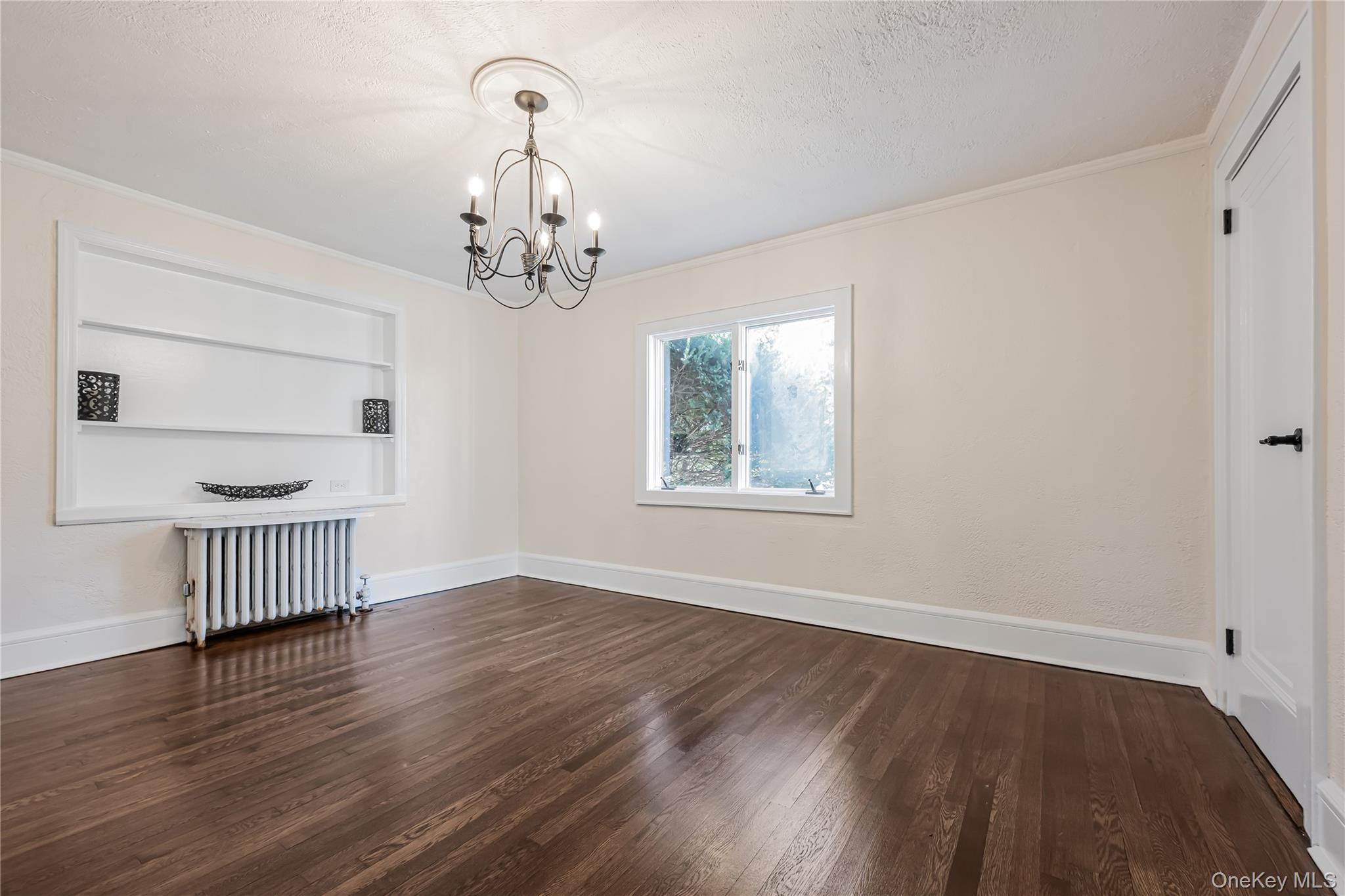 39 Hillcrest Road Hartsdale, NY 10530 - Photo 11 of 42 a view of empty room with wooden floor and fan
