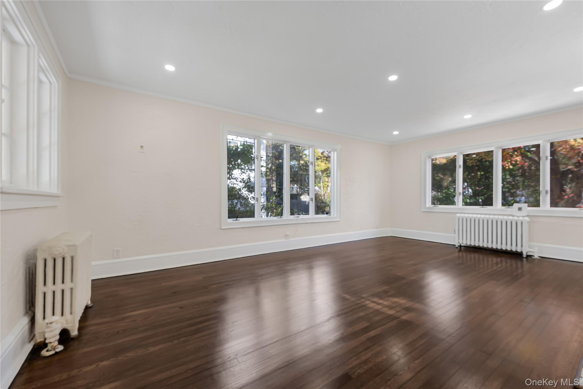 39 Hillcrest Road Hartsdale, NY 10530 - Photo 13 of 42 a view of an empty room with wooden floor and a window