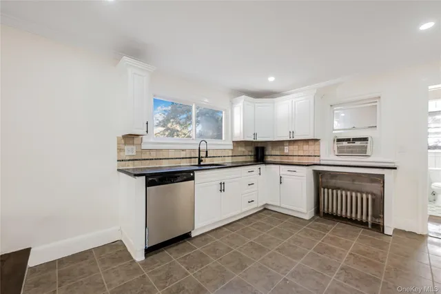 a kitchen with stainless steel appliances granite countertop a sink and cabinets