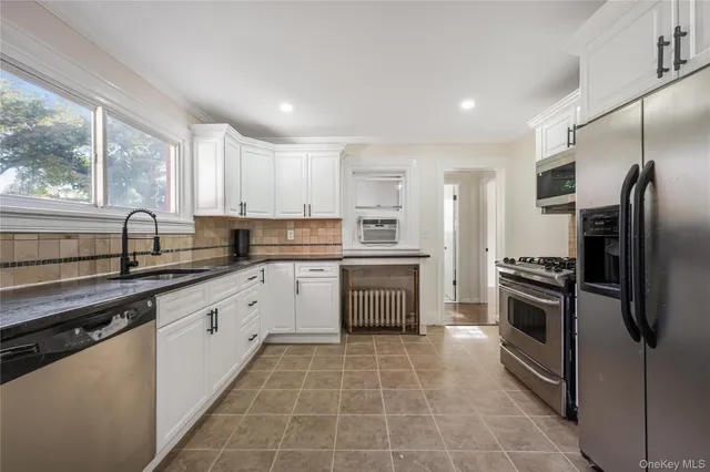a kitchen with a sink stove and refrigerator