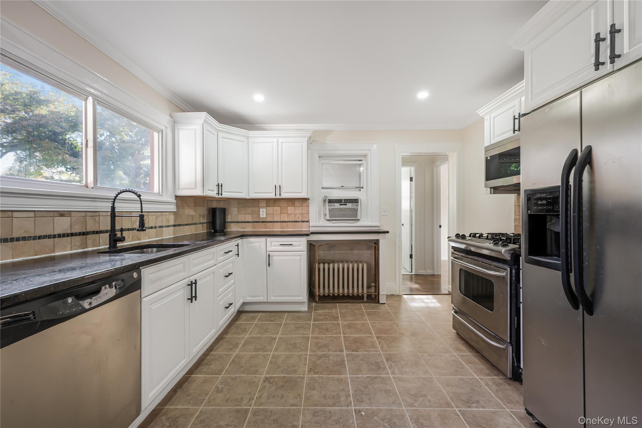 39 Hillcrest Road Hartsdale, NY 10530 - Photo 19 of 42 a kitchen with a sink stove and refrigerator